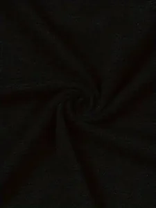 Detailed close-up view of the soft black knit fabric showing the material and texture