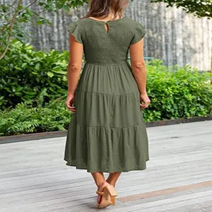 Back view of olive green tiered midi dress with smocked bodice and flutter sleeves design