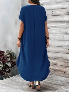 Back view of a navy blue oversized maxi dress with short sleeves and a loose fit