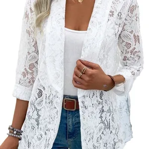 Close-up of elegant white floral lace blazer jacket for women with open front detail
