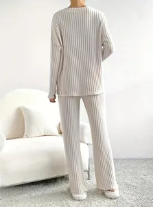 Detailed back view of minimalist off-white ribbed two-piece lounge set for women