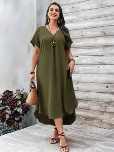 Full length view of a plus size army green V-neck casual maxi dress with irregular hem.