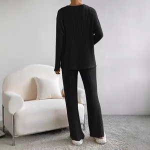 Elegant black ribbed two-piece lounge set with V-neck top and straight pants
