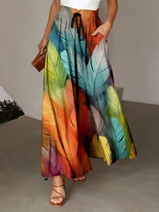 Detail view of Bohemian wide-leg trousers featuring a vibrant 3D digital feather print design