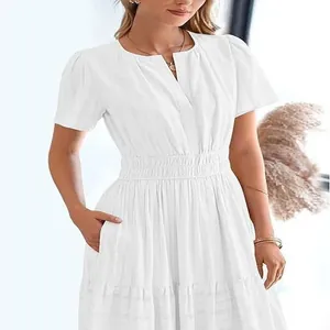Elegant white V-neck tiered maxi dress with puff sleeves and elastic pleated waist