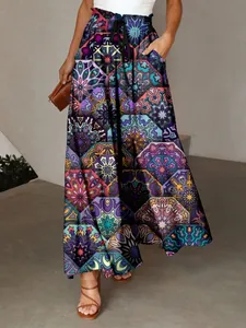 Detailed view of bohemian wide-leg pants featuring colorful geometric mandala patterns.