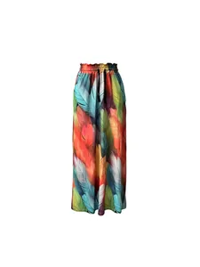 Detail of Bohemian wide-leg pants with vibrant 3D digital feather print and pleated waist
