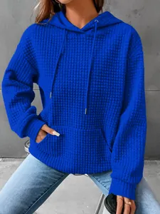 Vibrant blue women's waffle knit long sleeve hoodie with front pocket and drawstring