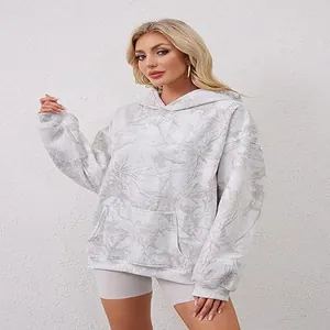 Women's oversized white hoodie featuring stylish gray leaf print and large front pocket