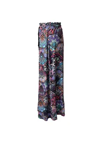 Detailed view of bohemian wide-leg pants with colorful mandala 3D digital print patterns
