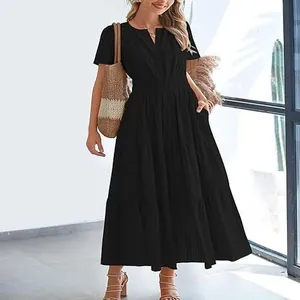 Elegant black V-neck tiered maxi dress with short sleeves and pockets for summer wear.