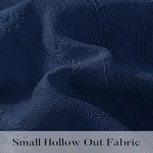 Detail shot of navy blue small hollow out fabric texture for elegant women's dress