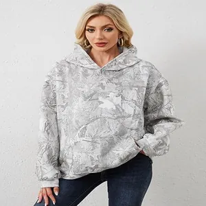 Stylish women's oversized hoodie featuring a grey leaf print pattern and functional kangaroo pocket