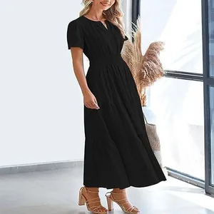 Detail view of a stylish black tiered maxi dress with V-neck and short sleeves