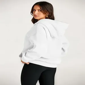 Detail view of a white oversized hooded sweatshirt for women, loose fit leisure style.