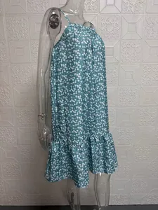 Side view detail of a floral sleeveless strap sundress displayed on a clear mannequin.