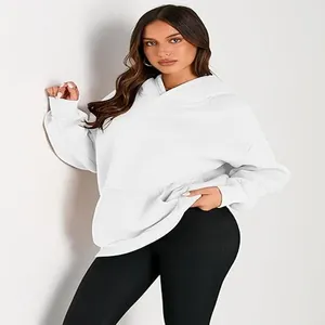 Detail of women's white oversized hoodie featuring a comfortable loose fit and soft texture.