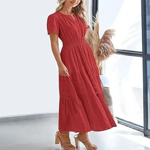 Elegant red V-neck tiered midi dress with puff sleeves, smocked waist and a tiered skirt.