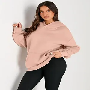 Fashionable loose-fit hooded sweatshirt for women in dusty pink with front pocket