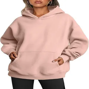 Detailed view of women oversized light pink hooded sweatshirt with soft fabric texture