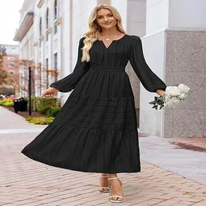 Elegant black V-neck tiered maxi dress featuring smocked waist and stylish puff sleeves.