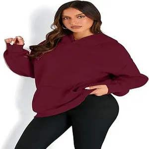 Detail view of oversized maroon hooded sweatshirt with comfortable kangaroo pocket.