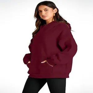 Detailed view of an oversized maroon hooded sweatshirt for women's casual wear.