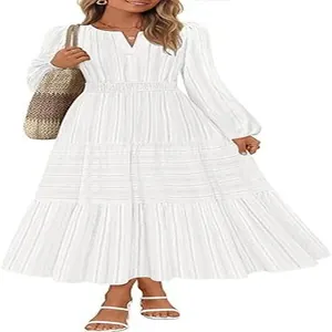 Elegant white V-neck tiered midi dress with long bubble sleeves and cinched waist detail.