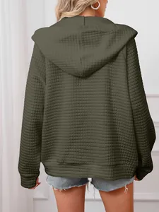 Back view of army green waffle knit hooded jacket for women with quilted texture