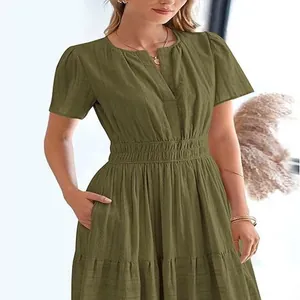 Stylish olive green V-neck tiered dress featuring puff sleeves and an elasticated waist detail.