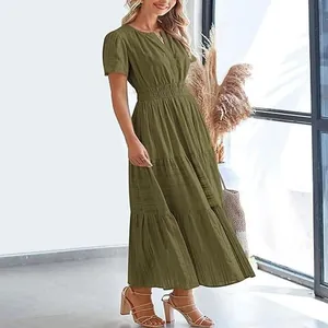 Detail of olive green V-neck tiered maxi dress with puffed sleeves and elastic waist