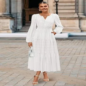 Elegant white V-neck tiered maxi dress with puffed sleeves for an urban lifestyle look.