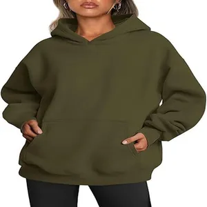 Close-up of olive green oversized hoodie with kangaroo pocket and drawstring hood