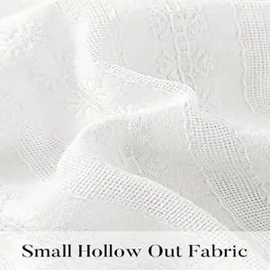 Detailed macro shot showcasing the small hollow out lace fabric texture for white dress