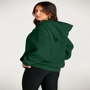 Detail view of the back of a women's dark green hooded sweatshirt for sports and leisure.