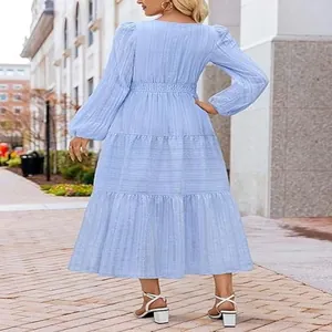 Detailed back view of a light blue tiered maxi dress featuring bubble sleeves and lace waist