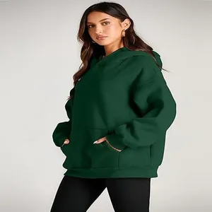 Detailed side view of a dark green oversized women's hoodie with a spacious front pocket