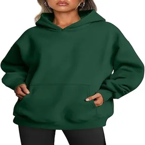 Detail view of an oversized dark green hoodie with a cozy kangaroo pocket and hood.