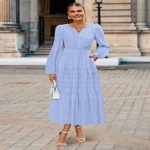 Elegant light blue V-neck tiered maxi dress with puff sleeves and cinched waist.