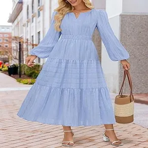 Elegant light blue V-neck tiered maxi dress with long puff sleeves and smocked waist