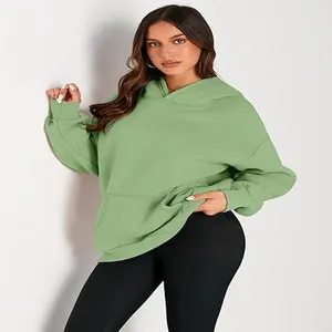 Premium light green oversized hoodie for women featuring a front pocket and soft fabric.