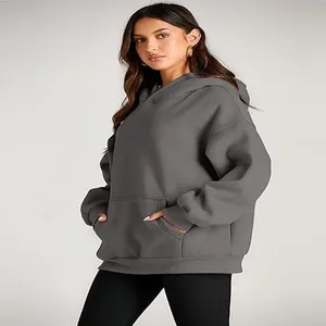Women's oversized grey hooded sweatshirt with front pocket and a relaxed casual fit