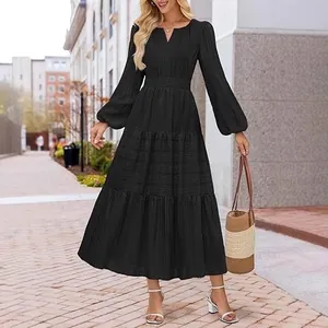 Elegant black V-neck tiered maxi dress with long puff sleeves and smocked waist design