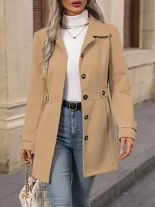 Close-up view of a camel lapel wool coat featuring elegant button details for fall and winter