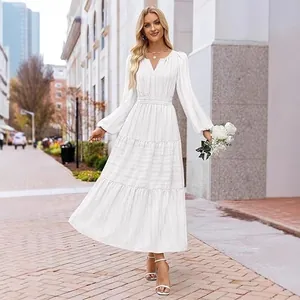 Elegant white V-neck tiered puff sleeve maxi dress for women presented in a city street