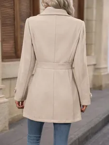 Detailed back view of an elegant slim fit beige woolen coat for women with waist seam