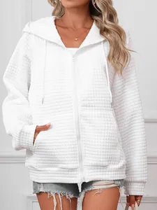 Detail of white waffle knit texture on a hooded zip-up sweatshirt jacket for women