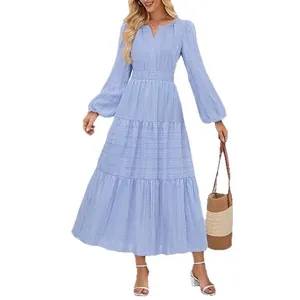 Elegant light blue V-neck tiered maxi dress with long lantern sleeves and cinched waist