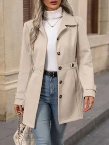 Detail of a chic cream-colored slim-fit wool coat with lapel and button accents