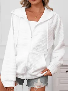 Detail shot of white waffle textured zip-up hooded sweatshirt with drawstrings for women